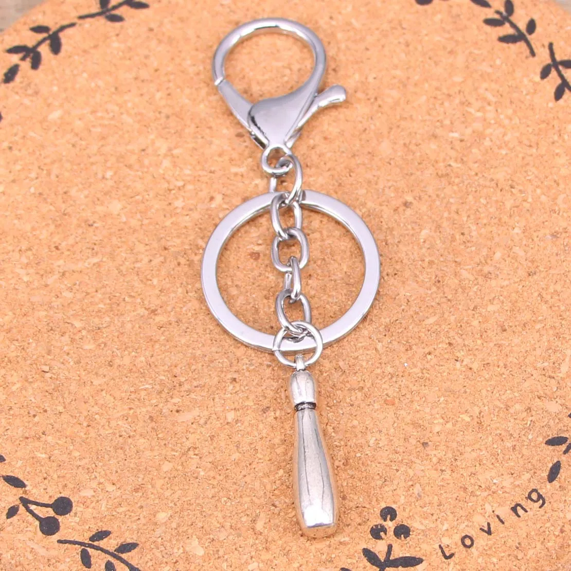 جديد الأزياء الفضة اللون سبائك قلادة حديدية قوارير البولينغ مفتاح ميدالية مفاتيح ذات حلقة هدية ل سيارة المفاتيح التبعي