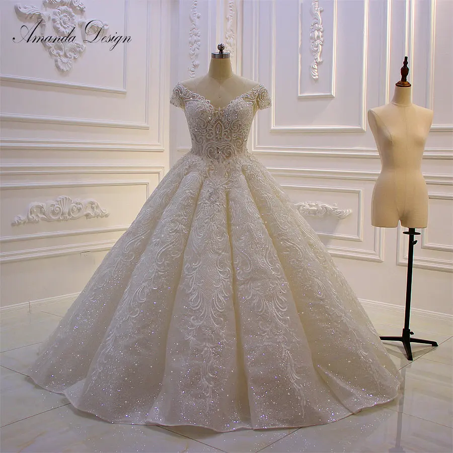 

Amanda Design suknia slubna Short Sleeve Shiny Pleat See Through Wedding Dress