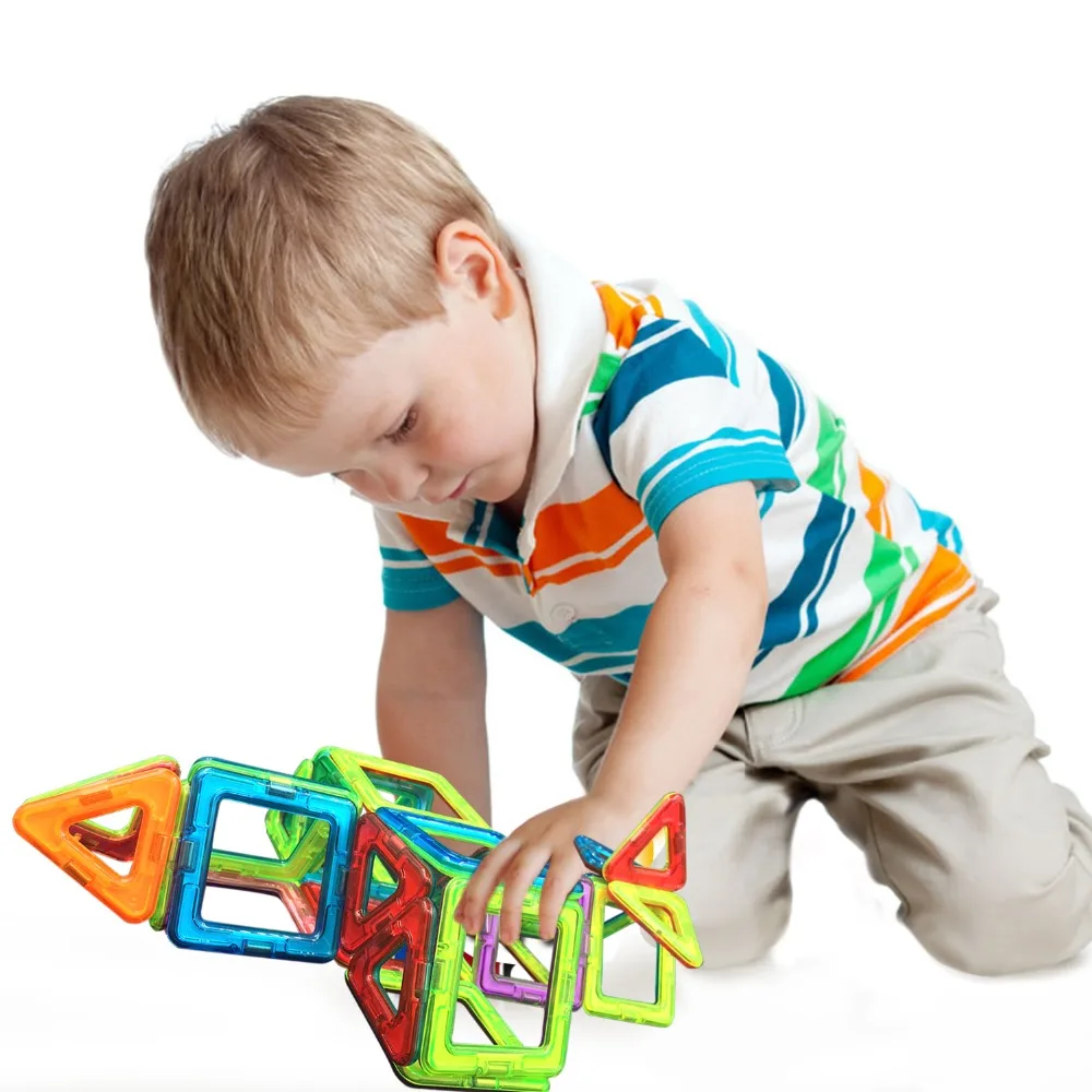boy with magnetic tiles