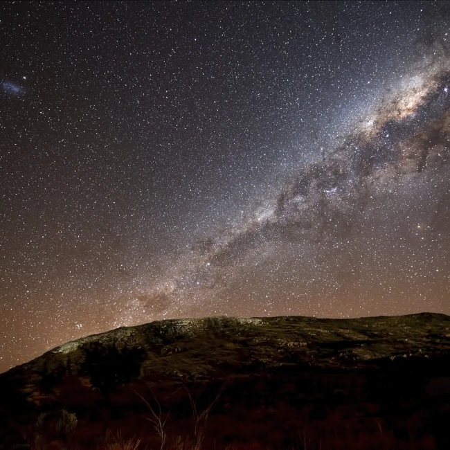 The Milky Way rising above the hills of Azul  Argentina Poster Print (34 x 22)