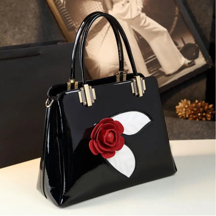 

Free shipping Fashion Patent leather Three-dimensional Flowers Shoulder oblique handbag