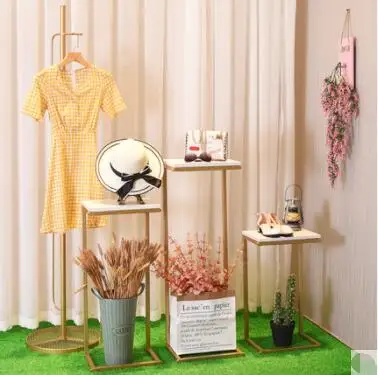 

Women's clothing shop window decoration table clothing store display hanging rack windbreaker hat rack decoration props table