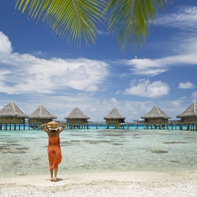 French Polynesia  Tuamotu Islands  Rangiroa Atoll  Woman On Beach Near Luxury Resort. Poster Print (18 x 12)