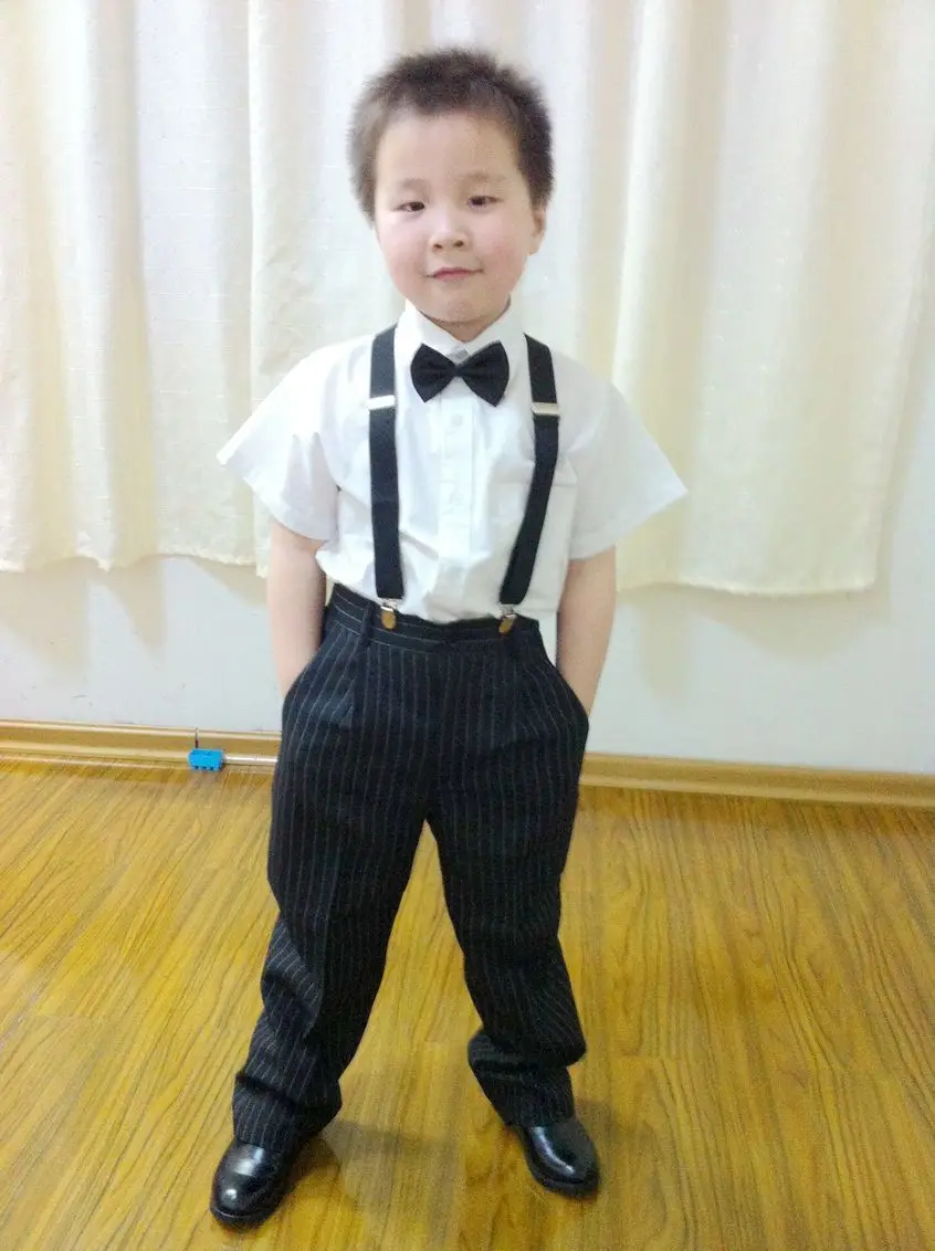 white polo shirt and black slacks