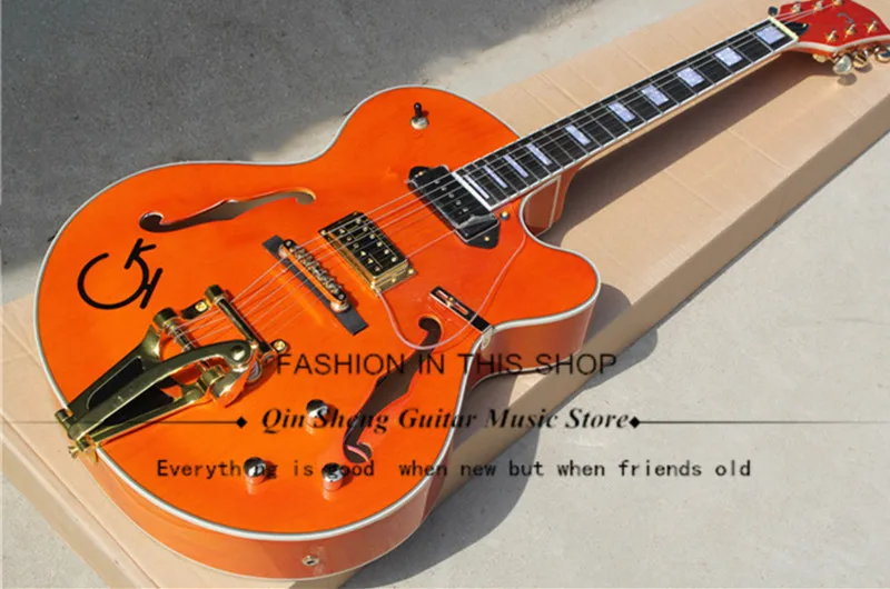 

Orange Semi-hollow Electric Guitar with Tremolo System,P90 pickups,acrylic Pickguard,Gold Hardwares,free shipping