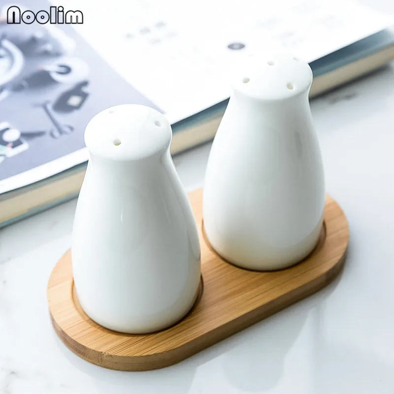

Pure White Simple Porcelain Salt and Pepper Shakers Bone China Salt Seasoning Jar Pepper Bottle Salt Pepper Kitchen Tools