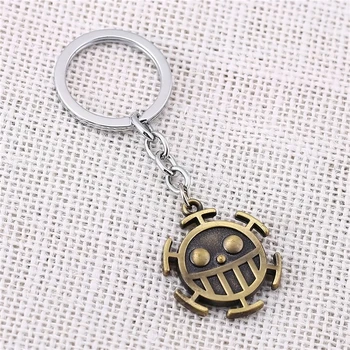 

Julie 10Pcs/lot Japanese Amine One Piece Trafalgar D Water Law Logo Zinc Alloy Brown Keychain Key Ring porte clef Chaveiro