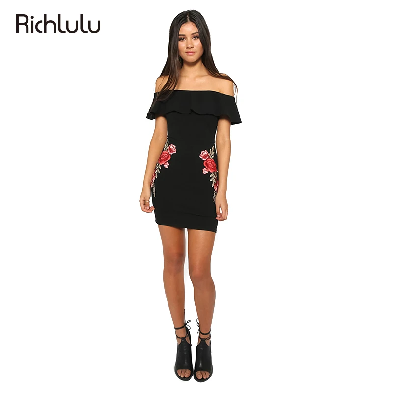 black bodycon dress with red roses at the waist