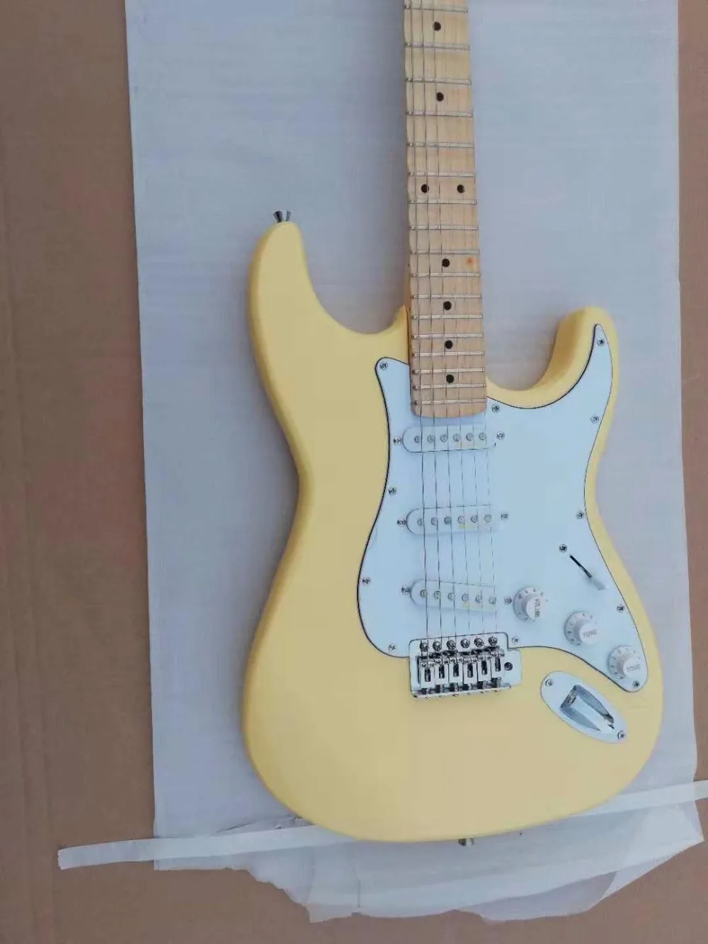 Cream yellow color st guitars with scollap necksin Guitar from Sports