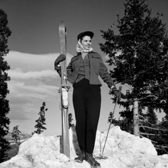 Woman holding skis and poles Poster Print (18 x 24)
