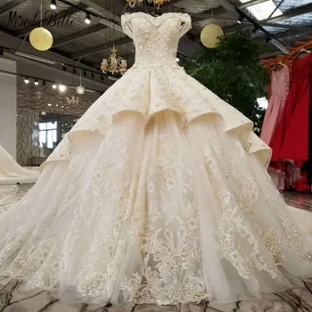 شراءفستان زفاف من Modabelle فاخر بدون أكمام وقلب مطرز بكشكشة من Vestido De Noiva ذو زهور ثلاثية الأبعاد فستان طويل لحفلات الزفاف 2018