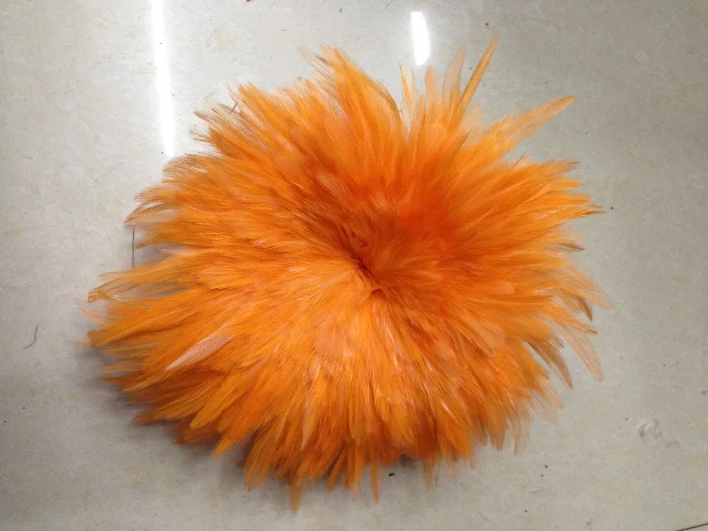The beautiful 4 6 inch white feather tip dyed orange, used for making a