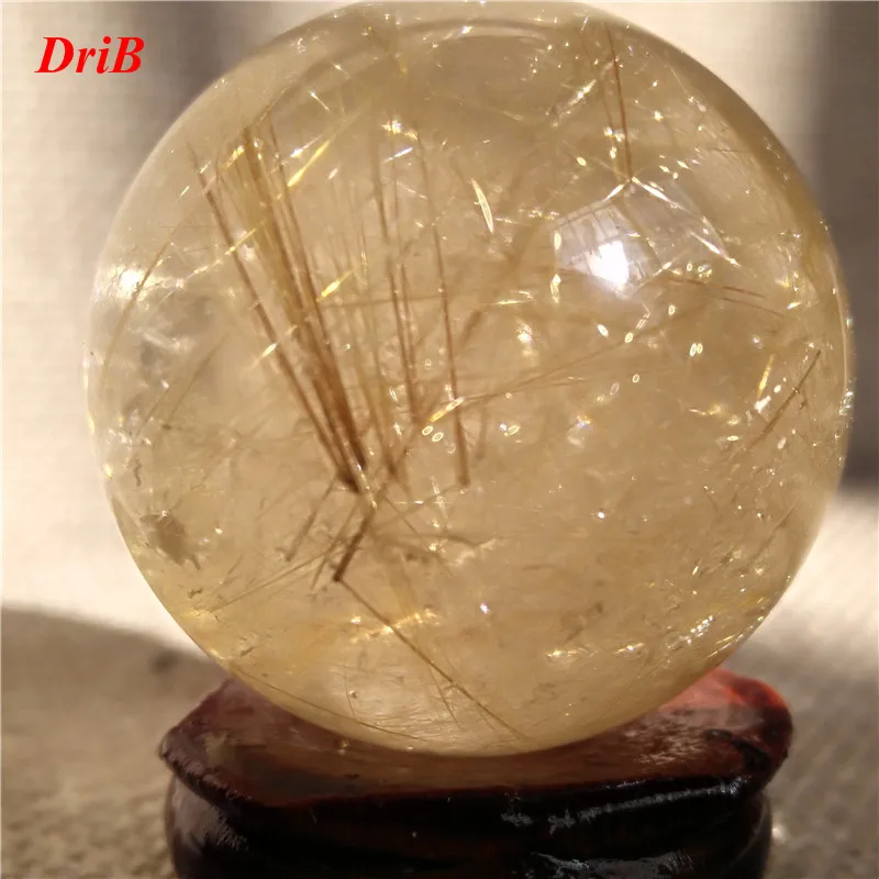 

Natural rutilated quartz crystal ball