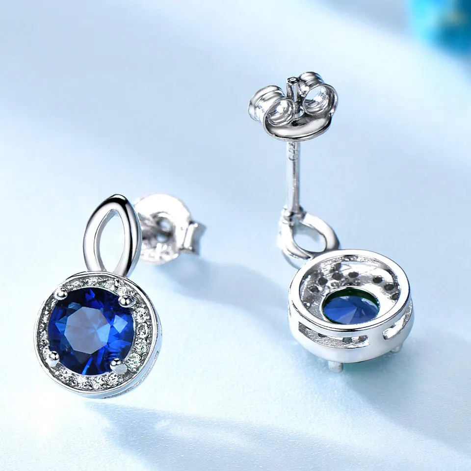 Серьги гвоздики женские круглые из серебра 925 пробы с синим