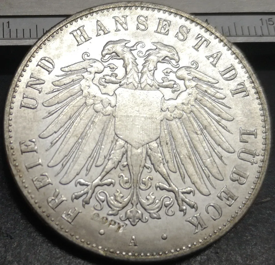 1904 Free Hanseatic city of Lubeck 5 Mark Silver Plated Copy Rare coin
1904 Free Hanseatic city of Lubeck 5 Mark Silver Plated Copy Rare coin