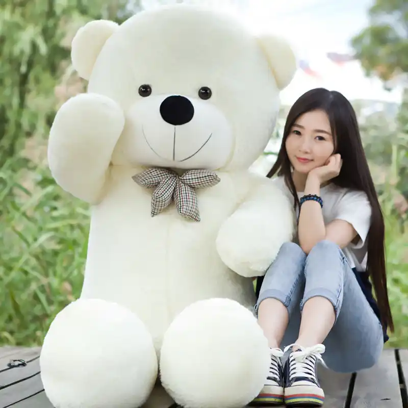 girl in giant teddy bear