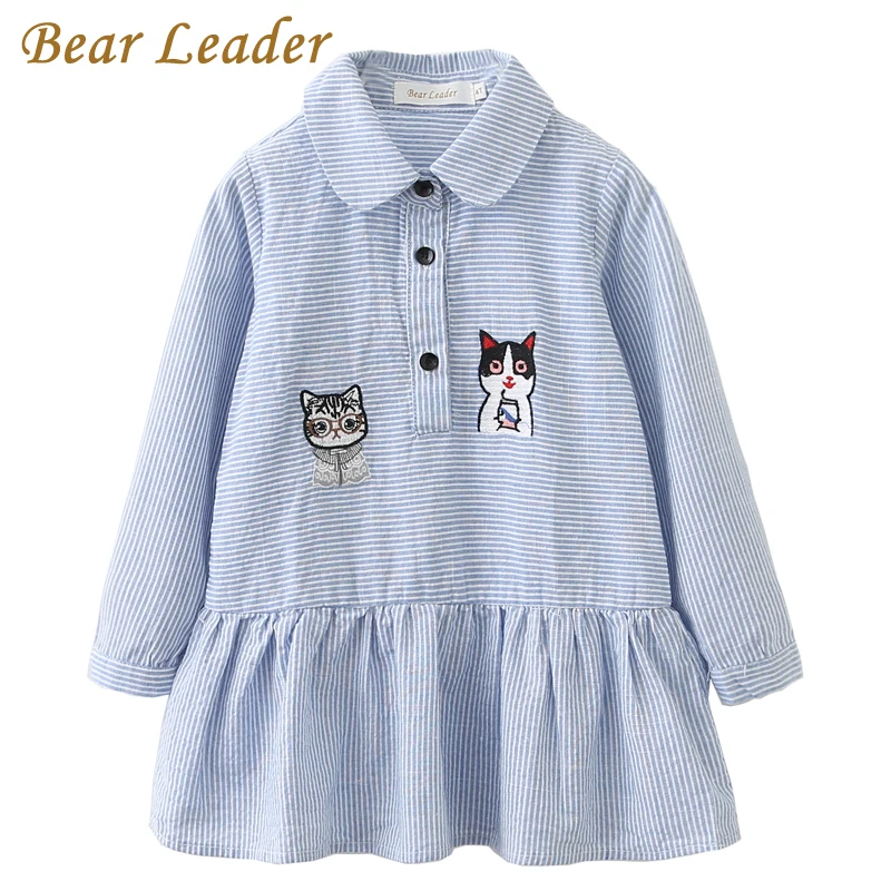 Long sleeve white dress with blue embroidery design