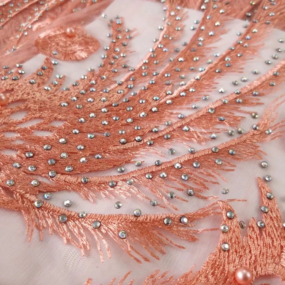 peach lace fabric with stones heavy beaded fabric fashion feather