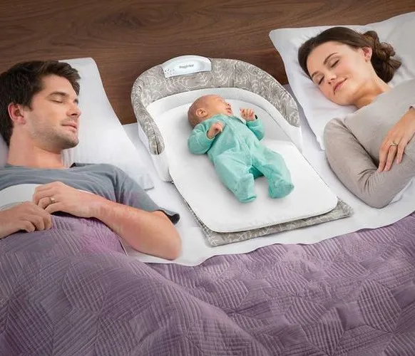 bassinet in the bed