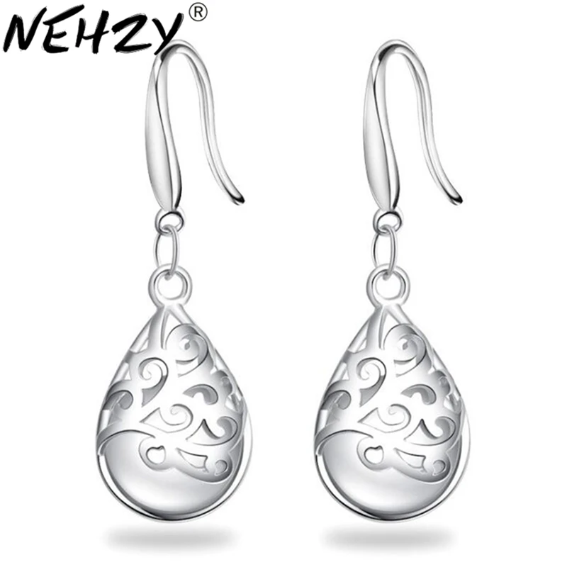 

Totem Wishing pool flower earrings fashion temperament female fringed jewelry cat 's eye Moonstone silver earrings