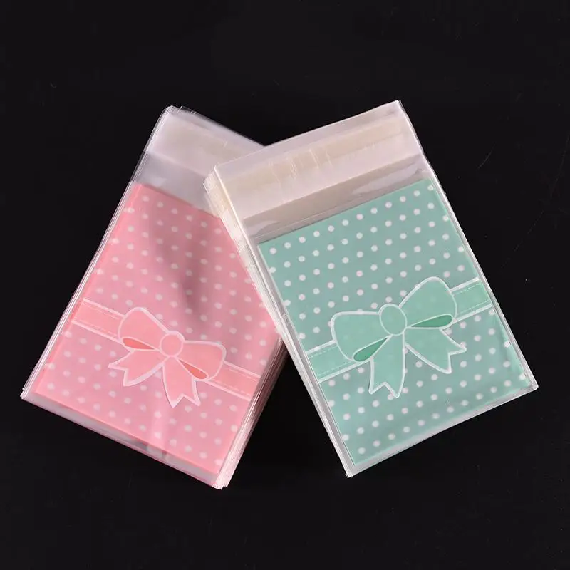 

100Pcs/bag Gift Sealing OPP Plastic Lovely Pink Blue Bow Adhesive Cake gift Packages Cookie Candy Pack Christmas Paper bags