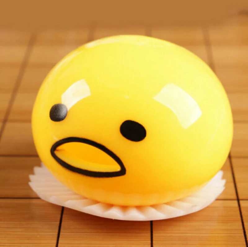 squishy puking egg yolk stress ball with yellow goop