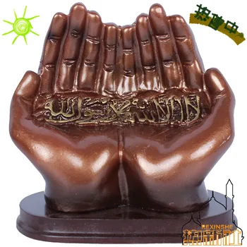 

Xinjiang Islamic Muslim ornament crafts praying hands Alcoran ornaments in front of large objects