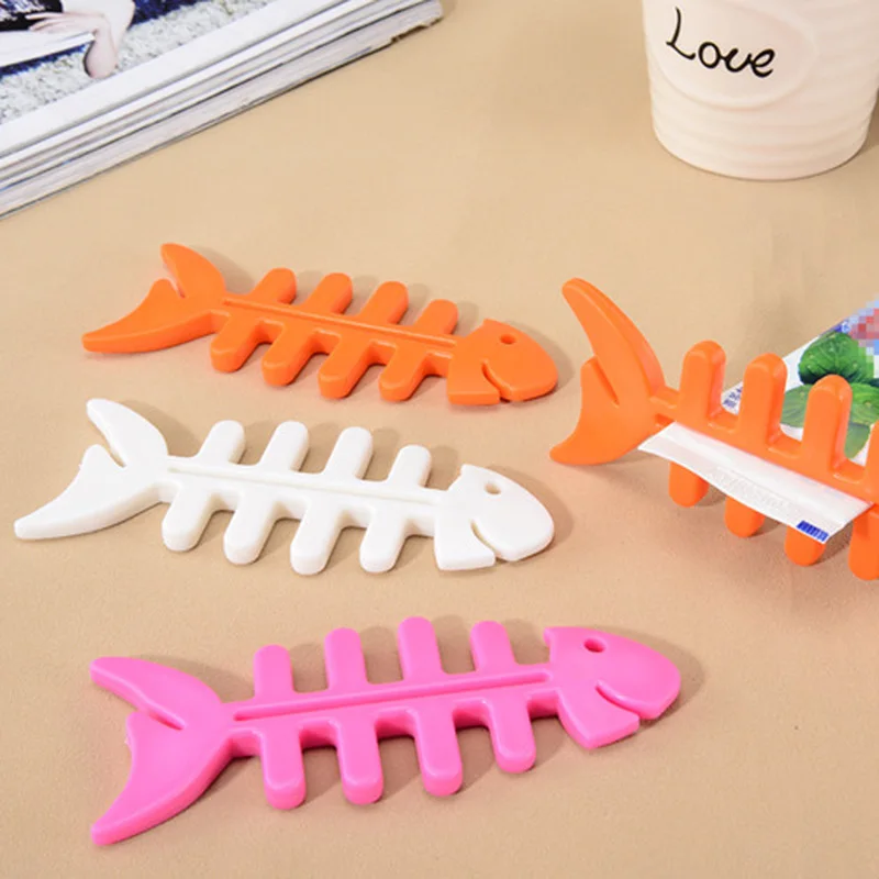 

Fish bone shape manual squeeze toothpaste facial cleanser hand cream squeezer three color optional support wholesale