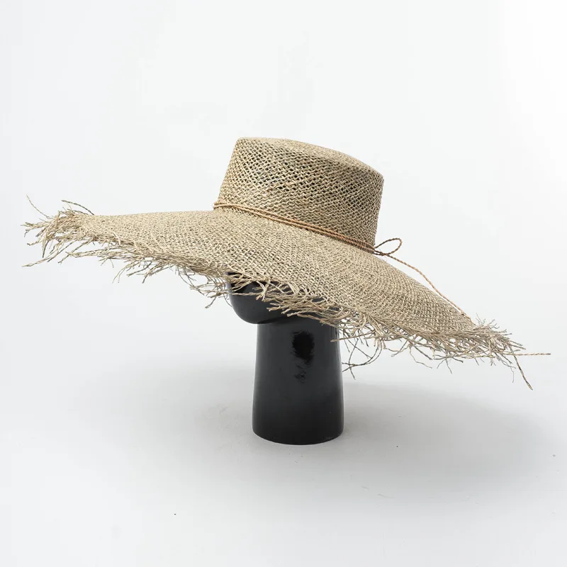 

New hand-woven large-edged flat-topped seagrass straw hat in spring and summer Europe and America beach hat sun hat adjustable