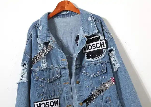 denim jacket with pins and patches