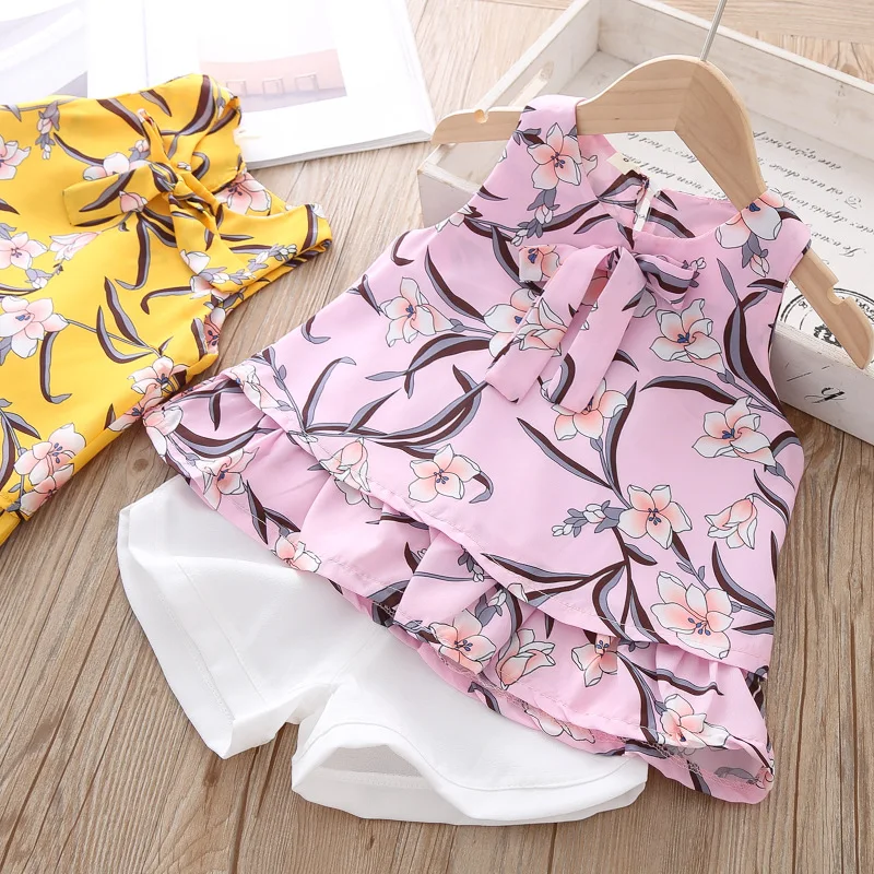

Toddler Girl Floral Outfits Shorts Set Kids Wholesale Lots Bulk Clothes Baby Girl Summer Ruffle Tops With Bow And White Shorts