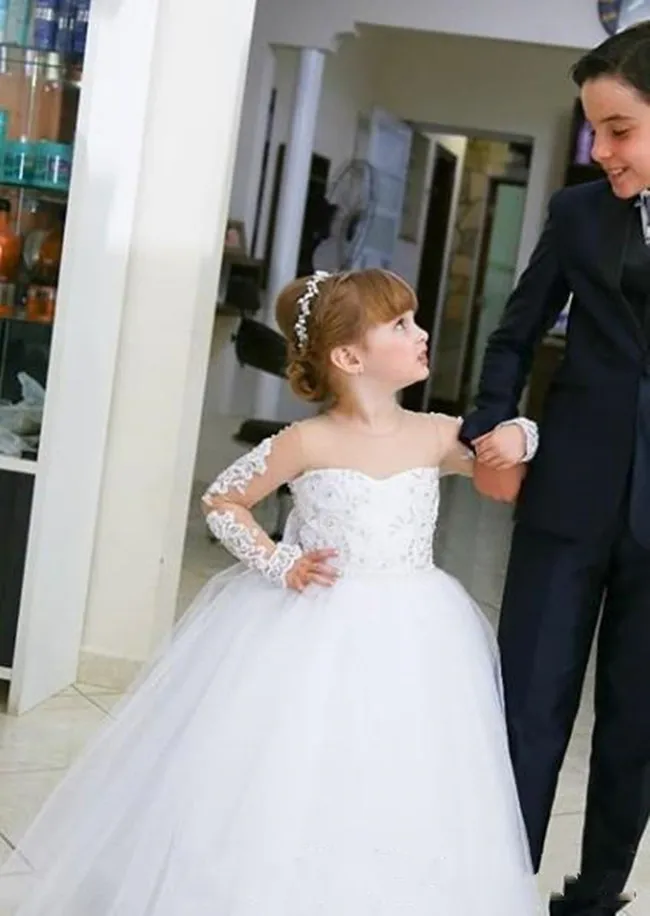 

Customzied Holy First Communion Gowns Sheer Neck Illusion Back Covered With Buttoons Bow Long Sleeves New Flower Girl DressesLX