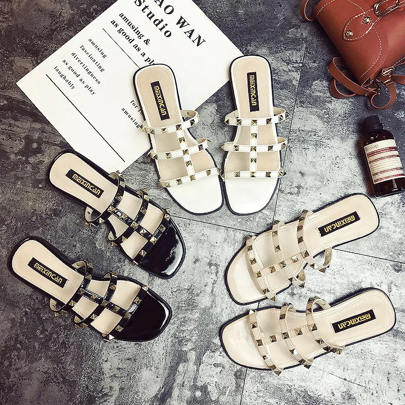 

Flat sandals female summer Roman rivet word with fashion wild 2019 new open toe student shoes
