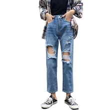 Новые женские джинсы с дырками и потертостями