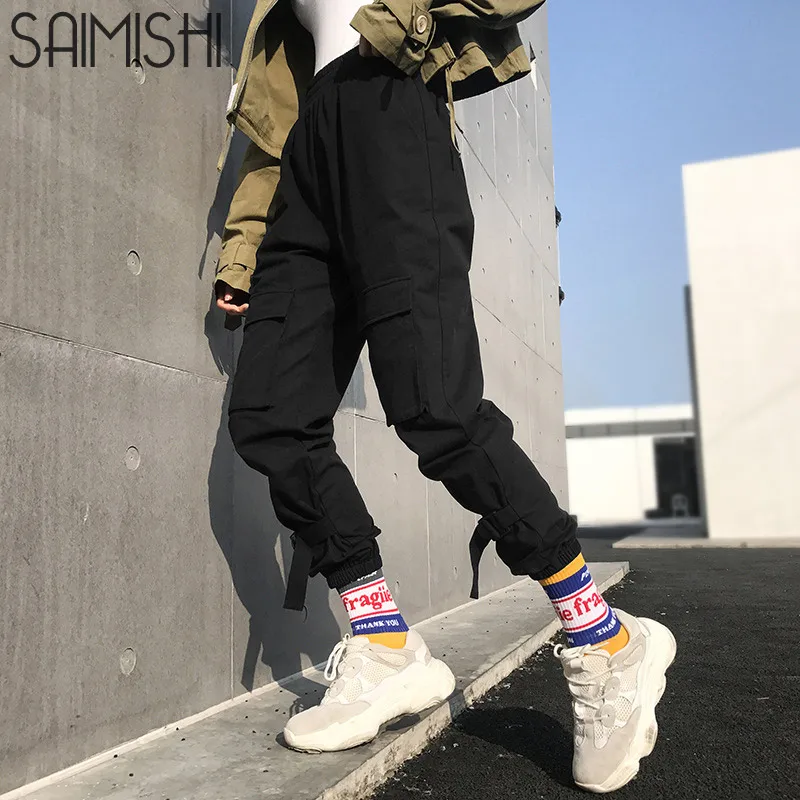 

Saimishi Streetwear Buckle Belt Detail Pockets Front High Waist Women Trousers Black Cotton Long Harem Pants Female Joggers