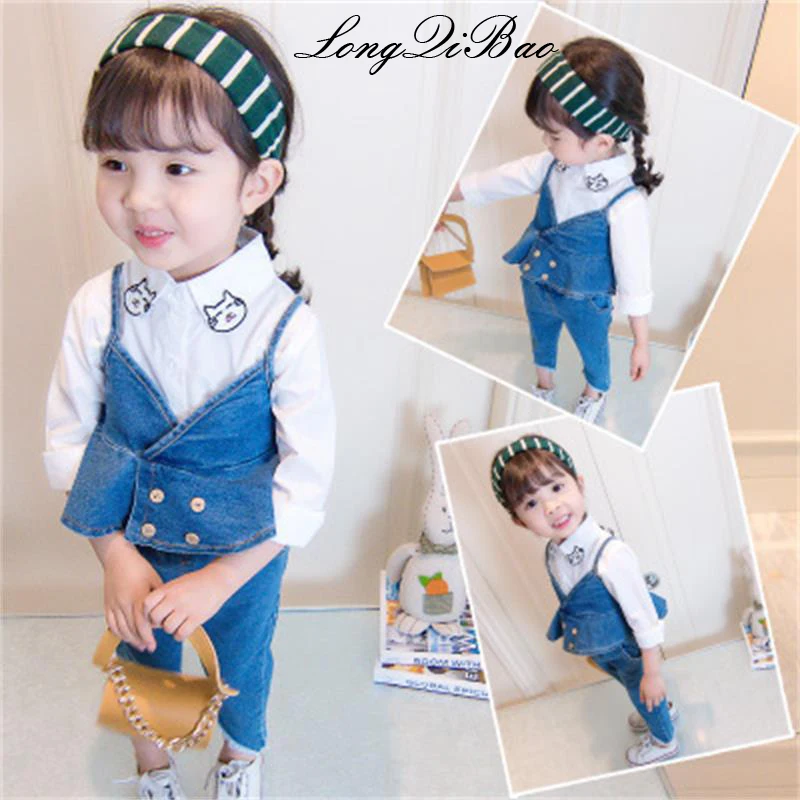 

Baby girl cotton autumn three-piece suit 2018 Korean version of the new cat long-sleeved shirt + denim strap skirt + pants suit