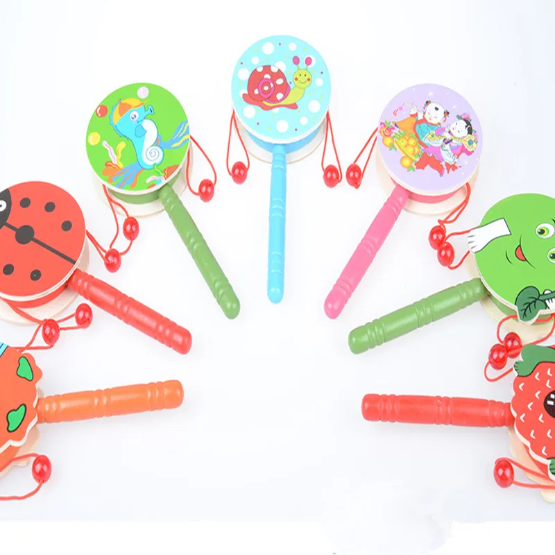 

1 pcs Wooden Stick 10 Jingle Bells Rainbow Hand Shake Bell Rattles Baby Kids Children Educational Toy - Random Delivery