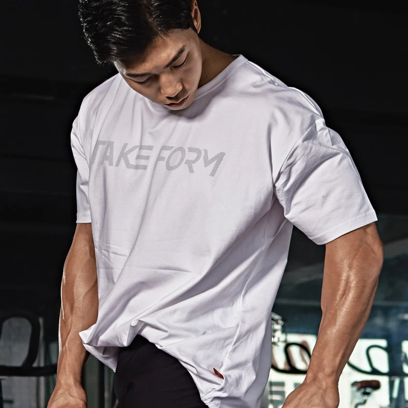 

Brand Fashion large size loose T Shirt Men Fast compression Breathable Mens Short Sleeve Fitness t-shirt Gyms Tight Casual Top