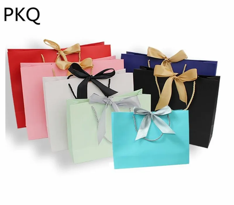 

Large Size Kraft Paper Gift Bag With Handles Small Present Box For Pajamas Clothes Books Packaging Ribbon Handle Paper Box Bags