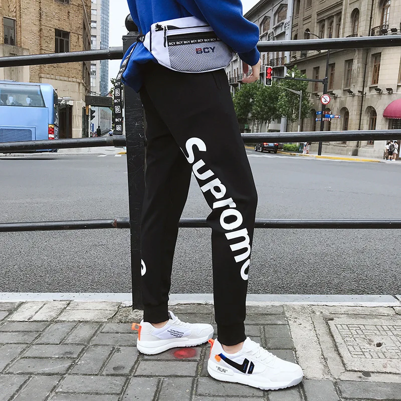 Spring and autumn tide brand men's casual trousers pure color printing bouquet feet feet pants men's sports casual pants men