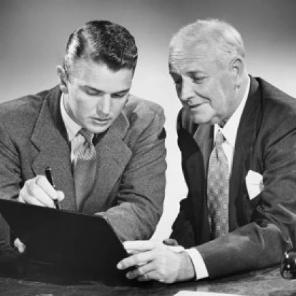 Close-up of two businessmen reading a file Poster Print (18 x 24)