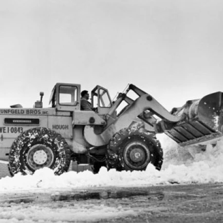Snowplow removing snow from a road Poster Print (24 x 36)