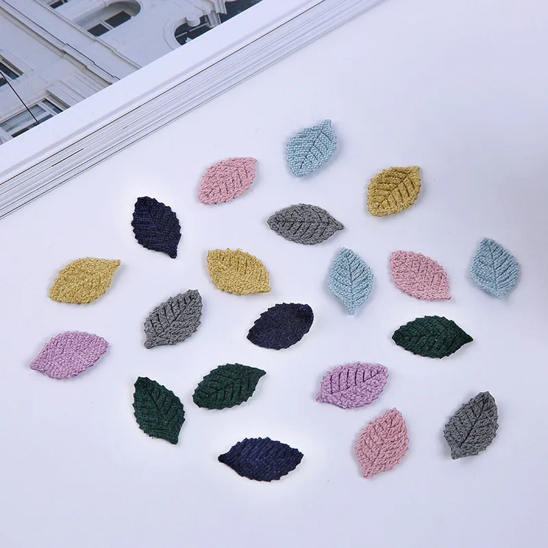 

20pcs/lot multicolor fabric leaves are not trimmed. The girl's hair is hand-made by hand.