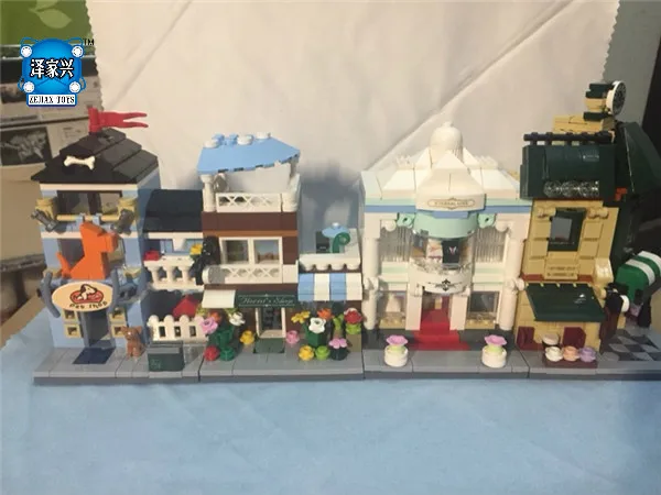 

XingBao Genuine 1079 Pcs The Coffee Shop Wedding Store Flower Shop Pet Shop Set 4 in 1 Building Blocks Bricks Toys Model