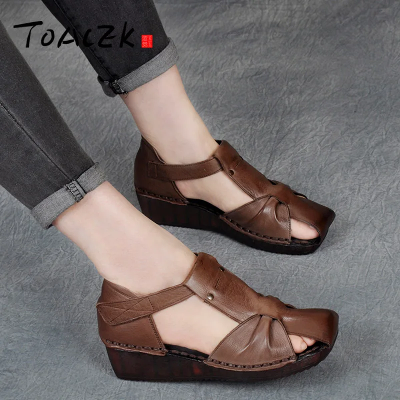 

Summer new Baotou female sandals, slope heel comfortable leather soft bottom handmade shoes, retro national style Roman shoes