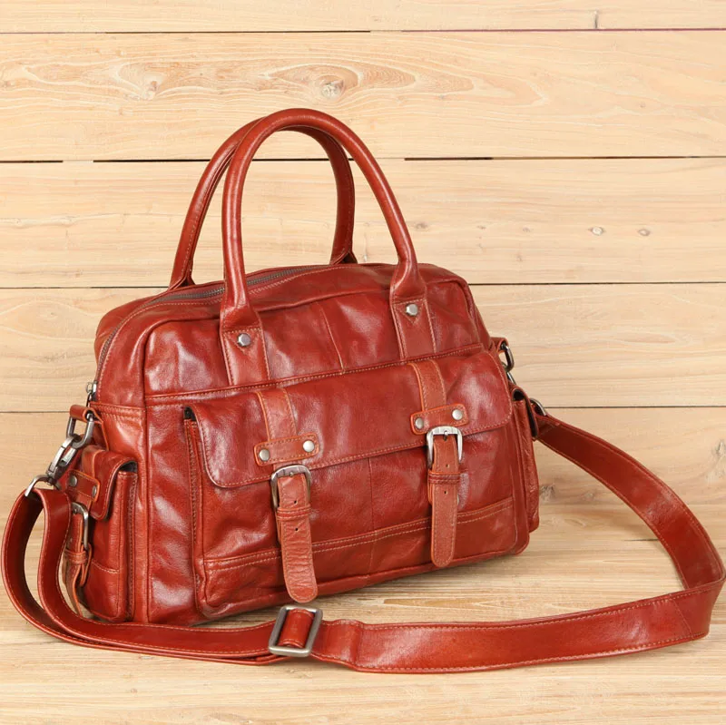 

2018 men's cow leather travel bag with pockets hand carry travel Duffle red black genuine leather bag with shoulder strap
