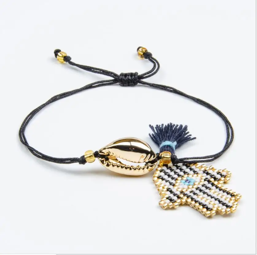 

1pcs simple and stylish bohemian gold-plated shell tassel woven bracelet jewelry