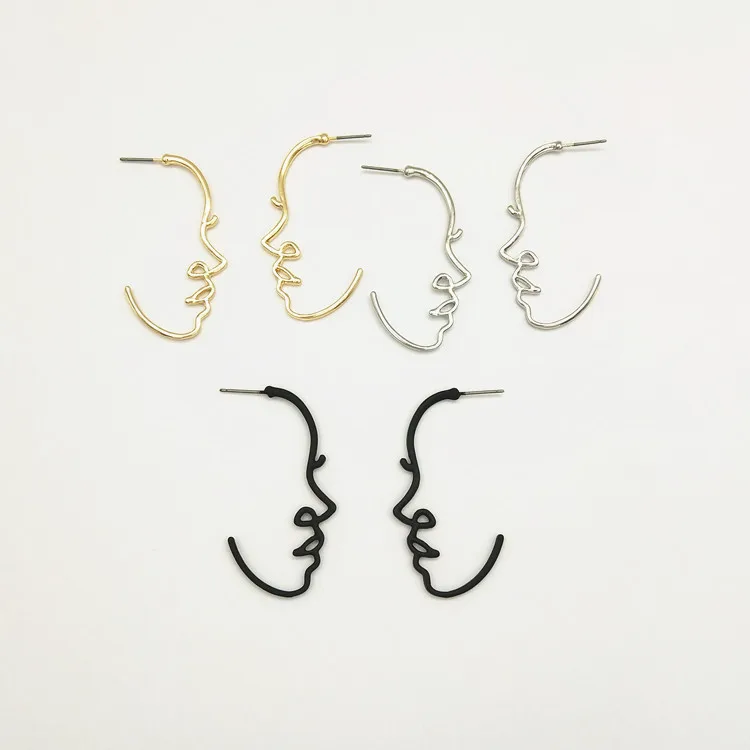 

Free Shipping Metal Face Outline contour earrings simple hollow texture Exaggerating Abstract Earrings