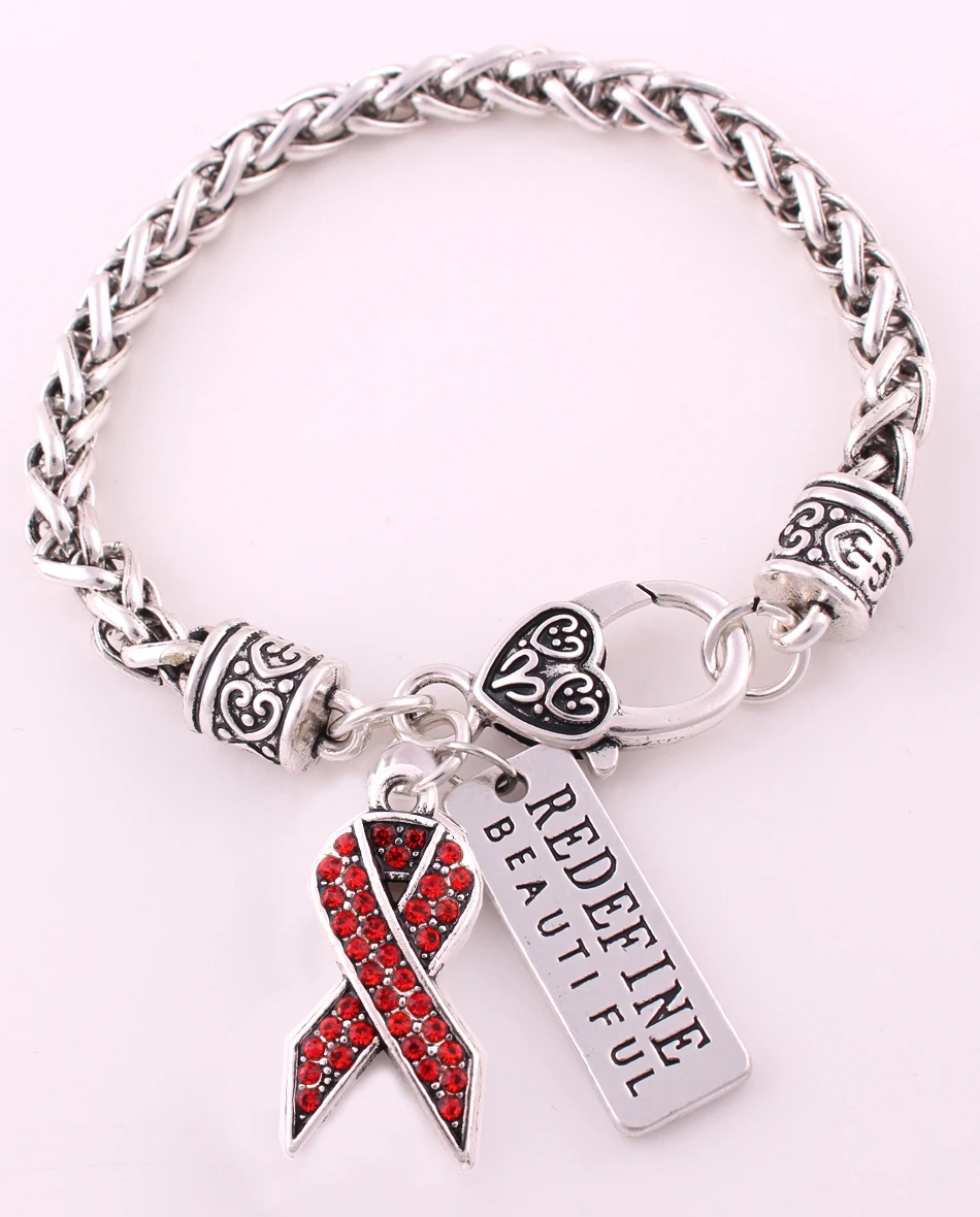 

Multi-color studded with sparkling crystal BREAST CANCER RIBBON and REDEFINE BEAUTIFUL charm bracelet