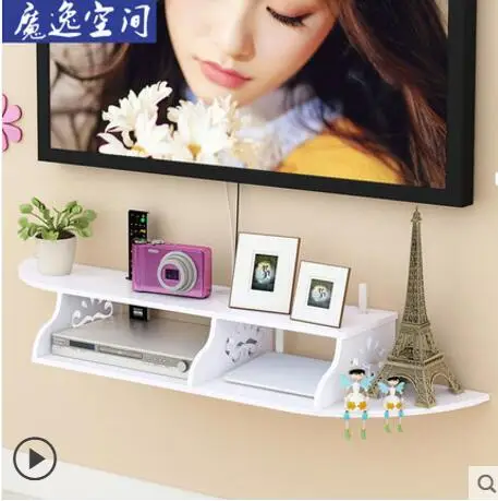 

TV set-top box shelving on the living room wall is perforated free